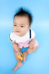 Asian Baby on blue background