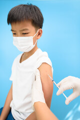 Vaccination in young Asian boy