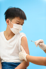 Vaccination in young Asian boy