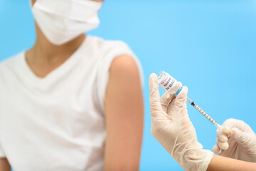 Vaccination in young Asian boy