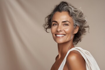 Portrait of a beautiful mature woman smiling and looking at the camera