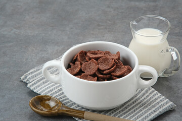 Bowl of cereal chocolate flavor, sweet crunchy 
