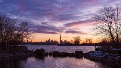 An early morning walk through Humber Bay Shores Park to view a sunrise across the metropolitan city of Toronto, Ontario, Canada