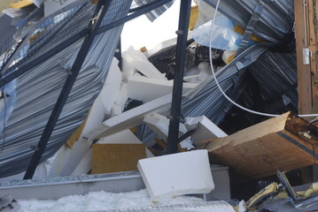 Collapsed house on a cold wintry day.