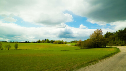 Green fields in Kashubia region - Northern Poland. - obrazy, fototapety, plakaty