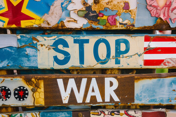 Sign on the wall saying "Stop the war"