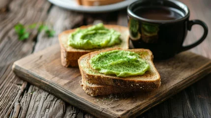 Poster Avocado bread toast sandwich with coffee. Morning breakfast background. © Jane Kelly