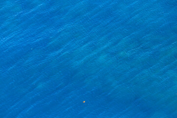 Aerial view blue sea background. Marine natural background texture with copy space. Drone view.