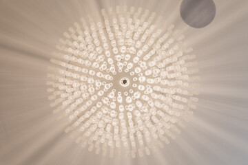Modern chandelier hanging on a ceiling
