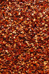 Fiery Red Bliss: Close-Up of Saturated Chili Flakes Texture