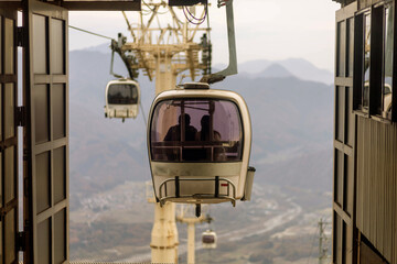 View of cable cars or gondola going up and down a mountain