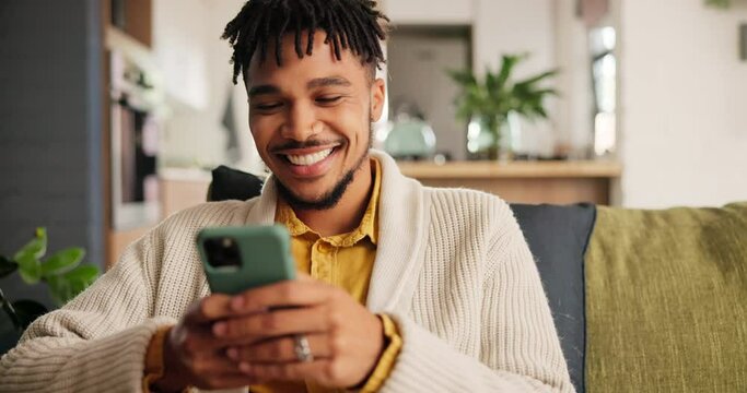 Smile, cellphone and young man networking on social media, mobile app or the internet on sofa at home. Happy, technology and male person scroll on website with phone in living room at apartment.