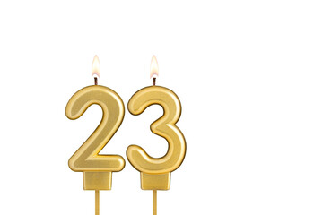 Golden number 23 birthday candle on white background