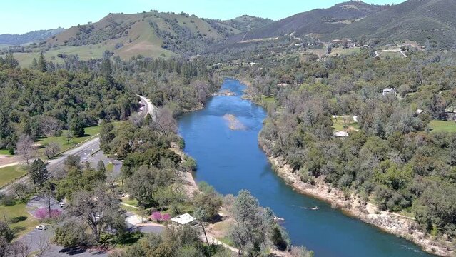 North Fork of the American River at the gold discovery site in Coloma, California showing the rapids and the Sutter Bridge. 