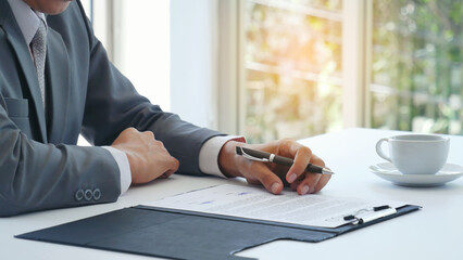 Businessman hand using pen signing on new contract starting projects in conference room. Close up business manager man hands sign contract legal document in meeting room. Business agreement concept - obrazy, fototapety, plakaty