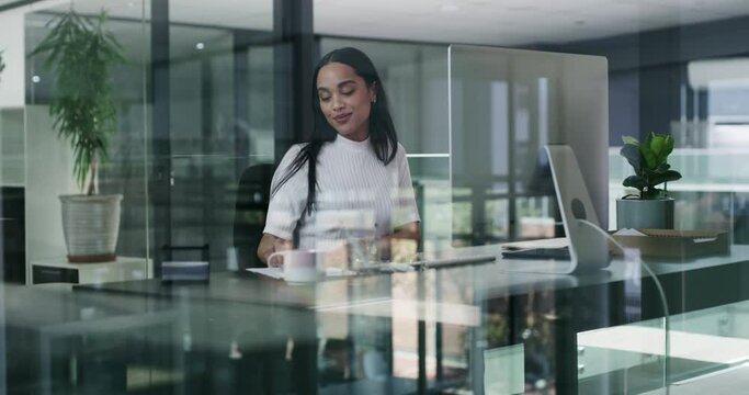 Computer, writing and business woman in glass office for planning, research work or project report. Corporate, desk and window with young employee reading or typing email in professional workplace