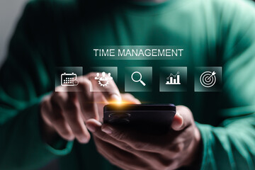Time management concept. Work planning for increases efficiency and reduces work time. Business project planning. Person using smartphone with time management icon on virtual screen.