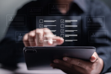 Human resource management concept. recruiting, leadership and team building. Hr manager use tablet filling out online employee appraisal form.