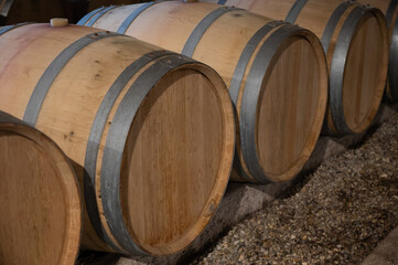 WIne celler with french oak barrels for aging of red wine made from Cabernet Sauvignon grape variety, Haut-Medoc vineyards in Bordeaux, left bank Gironde Estuary, Pauillac, France