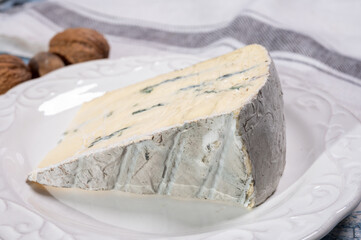 French goat cheese with black summer truffles mushrooms close up