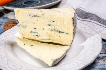 French goat cheese with black summer truffles mushrooms close up