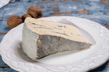 French goat cheese with black summer truffles mushrooms close up
