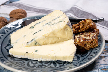 French goat cheese with black summer truffles mushrooms close up
