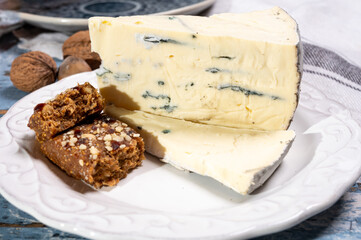 French goat cheese with black summer truffles mushrooms close up
