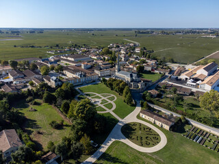 Aerial view on green vineyards, wine domain or chateau in Haut-Medoc red wine making region,...