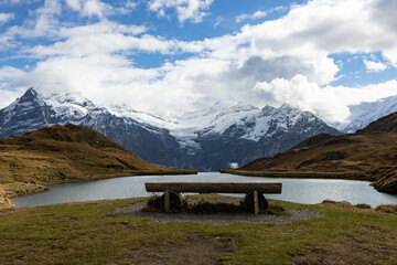 Stunning view at Bachalpsee, First Grindelwald, with a bench to sit, admire the view