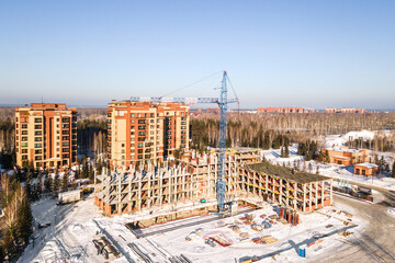 Naklejka premium the construction site of an apartment building in the winter from a height