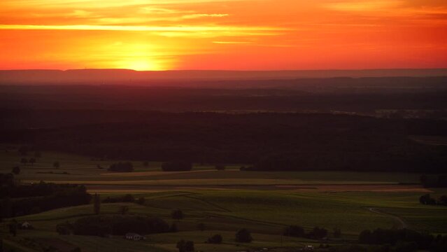 Sunset over green valley, Pupillin commune in Jura region, Bourgogne-Franche-Comte in eastern France.