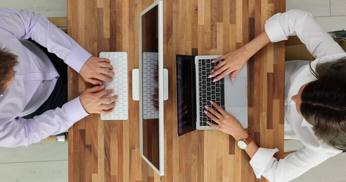 Young business colleagues working at computers in office top view