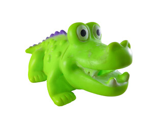 A green rubber crocodile toy that floats and makes a sound when squeezed is usually used as a bath companion for children, isolated on white background and close up shoot.