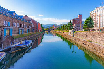 Fototapeta na wymiar Japan - September 3, 2023 : Scenic view of Otaru canal in summer blue sky day, Otaru canal is one of most famous tourist destination in Hokkaido