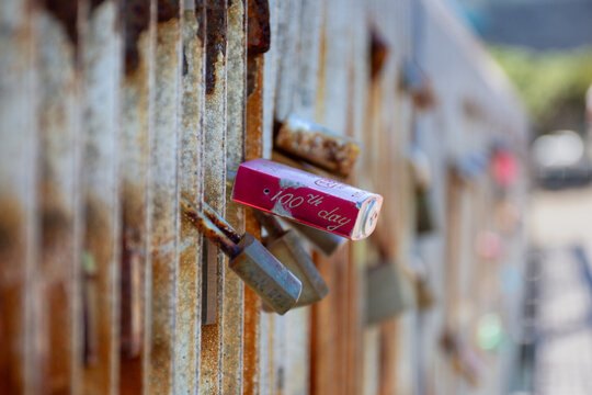 Padlock engraved with 100th day locked to a fence in Wellington, New Zealand 