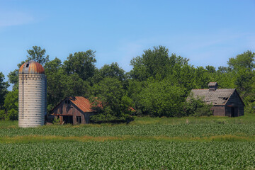 abandoned silo and buildings on an old farm © Peter