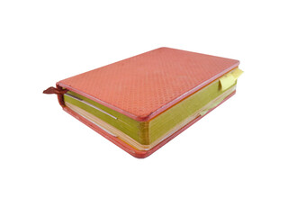 A pink leather-bound journal or book or folder used for notes with a bordered ribbon in the middle, isolated on white background with close up shot.