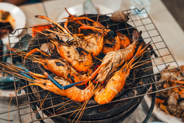 Shrimp grilled in a charcoal grill at a street food