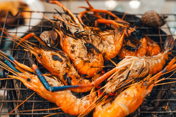 Shrimp grilled in a charcoal grill at a street food