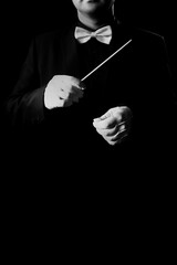 Music conductor orchestra conducting isolated on black background