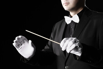 Music conductor orchestra conducting. Hands with baton