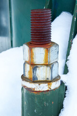 Rusty bolts in snow