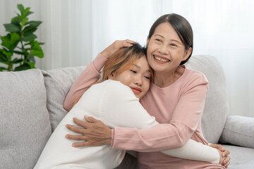 Obraz na płótnie Canvas Mother day, cute asian teen girl hugging mature middle age mum. Love, kiss, care, happy smile enjoy family time. celebrate special occasion, happy birthday, merry Christmas. special day