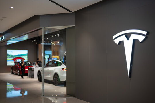 Bangkok, Thailand - Feb 2024: Tesla, the famous EV vehicle brand is opening new flagship showroom at Siam Paragon shopping mall, present and sale with Model 3 and Model Y.