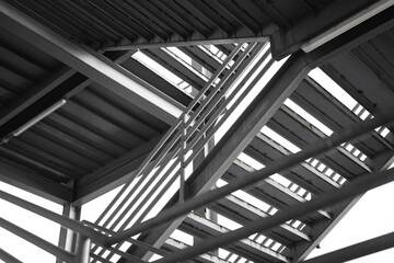 Metal overpass platform with banister structure of the factory place. Industrial building part. Close-up and selective focus. - obrazy, fototapety, plakaty