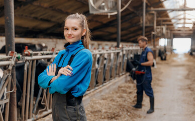 Portrait veterinary doctor young woman on background man with ultrasound device for rectal checking cow pregnancy. Concept worker of industry livestock cattle farm