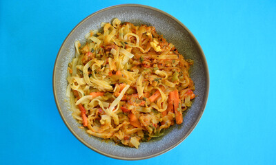 Delicious Pad Thai in a bowl on the table.