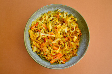 Delicious Pad Thai in a bowl on the table.