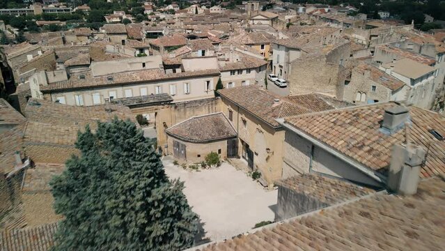 Lauris France weathered grey brown rooftops in the countryside, aerial dolly
